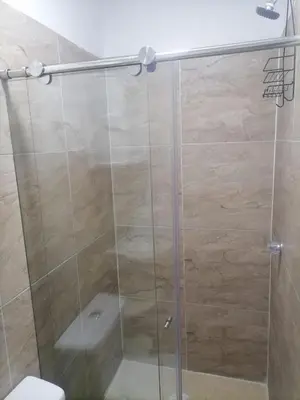 a bathroom with a glass shower with a toilet at Hostel AC in Cartagena de Indias