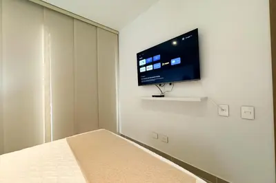 a bedroom with a flat screen tv on a wall at BaiaKristal - Kabo en Cartagena in Cartagena de Indias