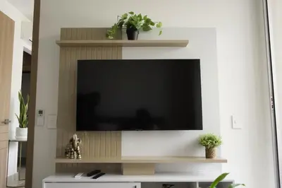 a flat screen tv on a wall in a living room at BaiaKristal - Kabo en Cartagena in Cartagena de Indias