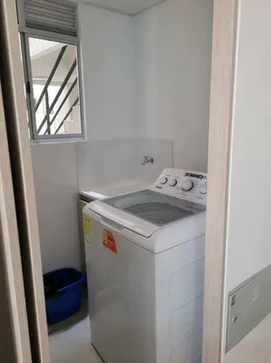 a small kitchen with a stove and a window at Refugio de ensueño in Manzanillo del Mar