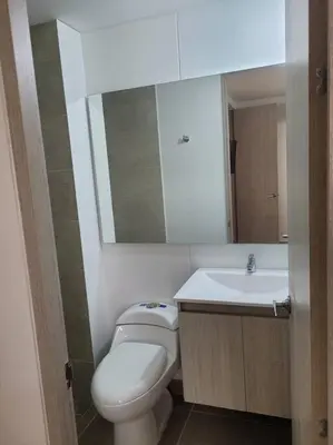 a bathroom with a white toilet and a sink at Refugio de ensueño in Manzanillo del Mar