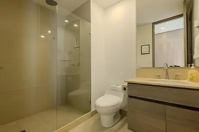 a bathroom with a toilet and a sink and a shower at Panoramic Sea View & Historic Center “Morros City” in Cartagena de Indias