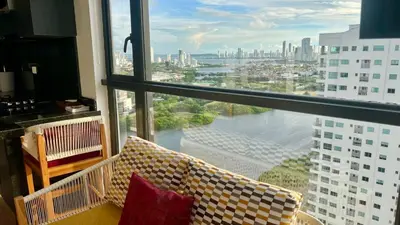 a view of a city from a large window at Luxury Murano Cartagena Condo in Cartagena de Indias