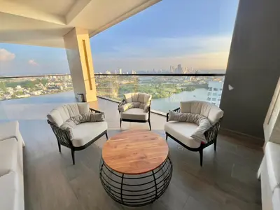 a balcony with a table and chairs and a view at Luxury Murano Cartagena Condo in Cartagena de Indias