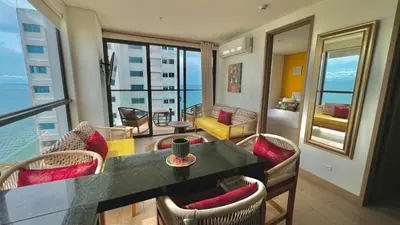 a living room with a table and chairs at Luxury Murano Cartagena Condo in Cartagena de Indias