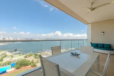a dining room with a view of the ocean at Luxury H2 piso 19 / Sea Bay View & Historic Center in Cartagena de Indias