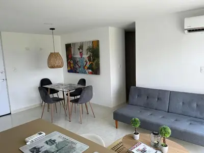 a living room with a couch and a table at Apartamento Económico En Coveñas in Coveñas