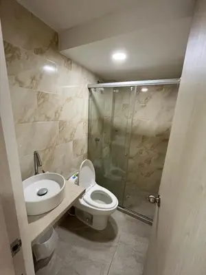 a bathroom with a toilet and a sink and a shower at Apartamento Económico En Coveñas in Coveñas