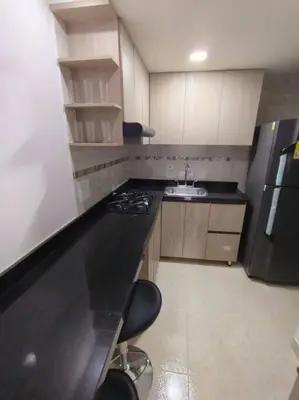 a small kitchen with a sink and a refrigerator at CARTAGENA CONFORT APARTAMENTO NUEVO y COMPLETO in Cartagena de Indias