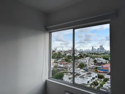 a window with a view of a city at Apartamento con 3 habitaciones y Vista al Mar in Cartagena de Indias