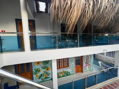 a balcony on a cruise ship with a painting on it at Cabaña Sol y Mar 2 in Coveñas