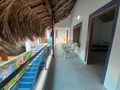 a room with a store with a pool and chairs at Cabaña Sol y Mar 2 in Coveñas
