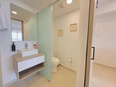 a bathroom with a sink and a toilet at Apartamento suite Cartagena - Cartagena Beach Resort in Cartagena de Indias