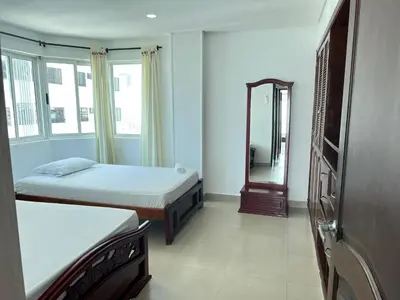a small room with two beds and a mirror at Apartamento con vista al mar in Cartagena de Indias