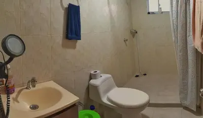 a bathroom with a toilet and a sink and a shower at Apartamento sereno, cerca al mar in El Porvenir