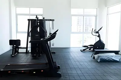 a gym with two treadmills and a treadmill at Modern 2BR next to the Walled City+Oceanside View in Cartagena de Indias