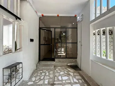 an empty hallway of a building with a glass door at Apartamento 2 habitaciones Paraiso, by Accommdo360 in Barranquilla