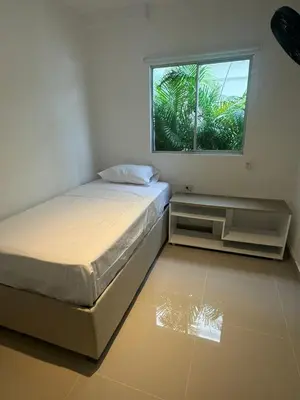 a bedroom with a bed and a window at Apartamentos Cartagena Acuarium in Cartagena de Indias