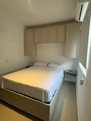 a bedroom with a large bed in a room at Apartamentos Cartagena Acuarium in Cartagena de Indias