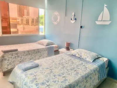 a room with two beds and a window at Apartamento Acogedor en Cartagena in Cartagena de Indias