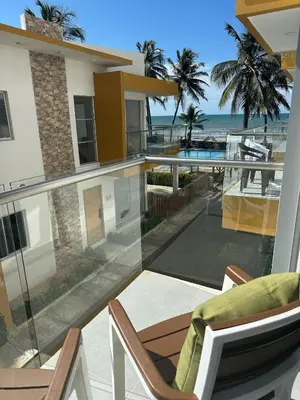 a house with a balcony with a view of the ocean at 203 Apartamento Frente al Mar in San Bernardo del Viento