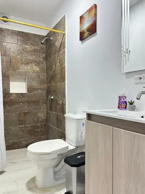 a bathroom with a toilet and a sink and a shower at 203 Apartamento Frente al Mar in San Bernardo del Viento