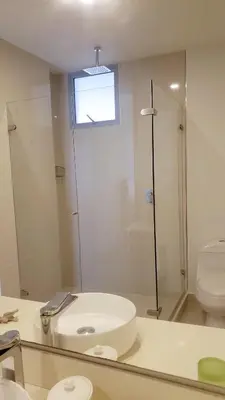 a bathroom with a sink and a toilet and a mirror at Apartamento Cartagena in Cartagena de Indias