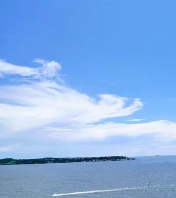 a large body of water with a blue sky and clouds at Cartagena Aparta Suite con Vista al Mar in Cartagena de Indias