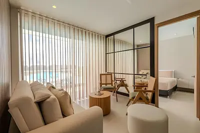 a living room with a couch and a bedroom at Lujoso A Estrenar/Oasis Laguna Cristalina 2BR in Los Arrayanes