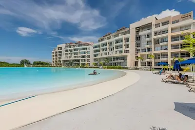 a view of the resort from the beach at Lujoso A Estrenar/Oasis Laguna Cristalina 2BR in Los Arrayanes