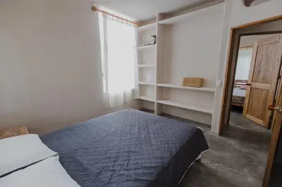 a bedroom with a bed and a window at Apartamento Atlantic 112 in La Perdiz