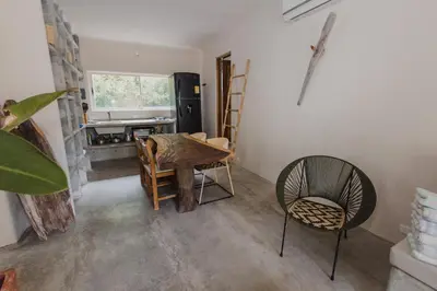 a dining room with a table and chairs and a fireplace at Apartamento Atlantic 112 in La Perdiz