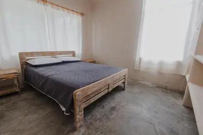 a bedroom with a bed in a room with a window at Apartamento Atlantic 112 in La Perdiz