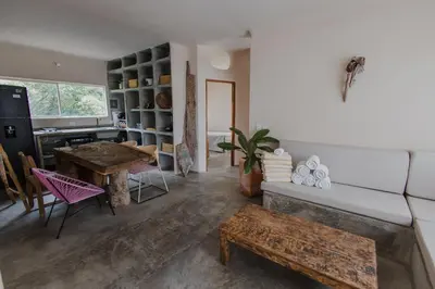 a living room with a table and a couch at Apartamento Atlantic 211 in La Perdiz