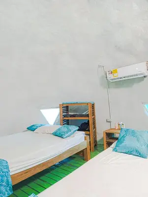 a room with two bunk beds and a fan at Barracuda Glamping in Paso Nuevo