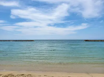 a view of the ocean with rocks in the water at Apartamentos Mi Reserva OK - Bahía Marina in Coveñas