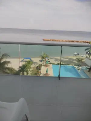 a view of the beach from a window of a cruise ship at Apartamentos Mi Reserva OK - Bahía Marina in Coveñas