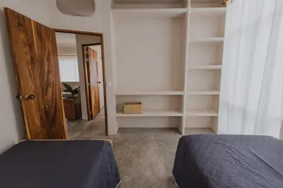 a bedroom with a bed and a book shelf at Apartamento Atlantic 212 in La Perdiz