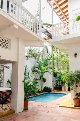 a courtyard with a swimming pool in a house at Casa Guerrero in Cartagena de Indias