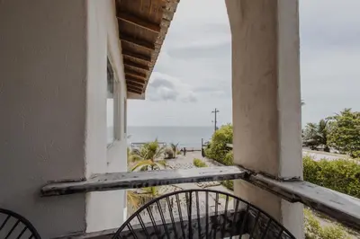 a window of a building with a view of the ocean at Apartamento Atlantic 312 in La Perdiz