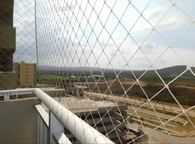 a view of a building from a wire fence at Apartamento en alameda del Río in Barranquilla