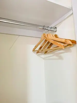 a bunch of wooden sticks hanging from a shelf at Tropical Oasis Barranquilla in Barranquilla