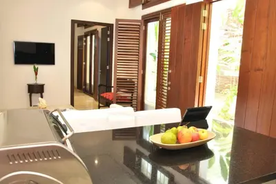 a kitchen with a bowl of fruit on a counter at Charming 1BR apartment in the Heart of Cartagena's Old City in Cartagena de Indias