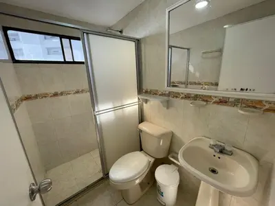 a bathroom with a toilet and a sink and a shower at Apartamentos En Edificio Portofino ICDI in Cartagena de Indias