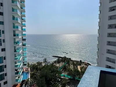 a view of the beach from the balcony of a building at Apartamentos En Edificio Portofino ICDI in Cartagena de Indias