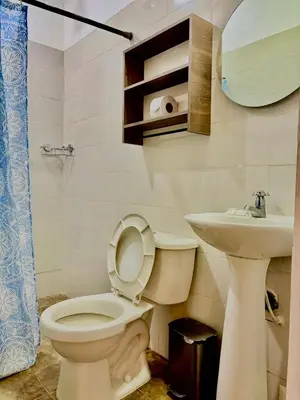 a bathroom with a toilet and a sink at Casa Centro Historico Hotel in Cartagena de Indias