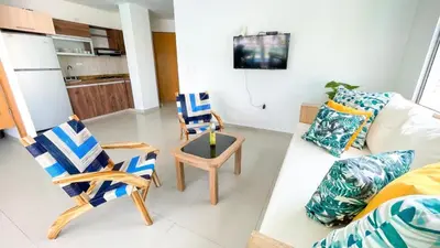 a living room with chairs and a couch at Hermoso Apartamento Frente al Mar 2 Habitaciones B12A in Coveñas