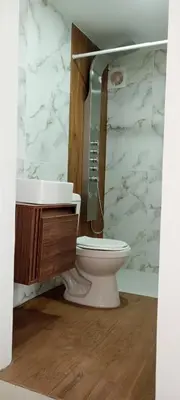 a bathroom with a toilet and a sink at Apartamento Manglar C Mallorquin Vista al Mar in Puerto Colombia
