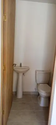 a bathroom with a toilet and a sink at Apartamento Manglar C Mallorquin Vista al Mar in Puerto Colombia
