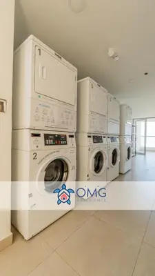 a row of washing machines in a laundry room at CB1204 | Suite minimalista frente al mar y atardeceres in Cartagena de Indias